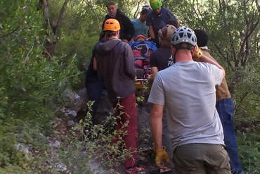 Injured climber being rescued.